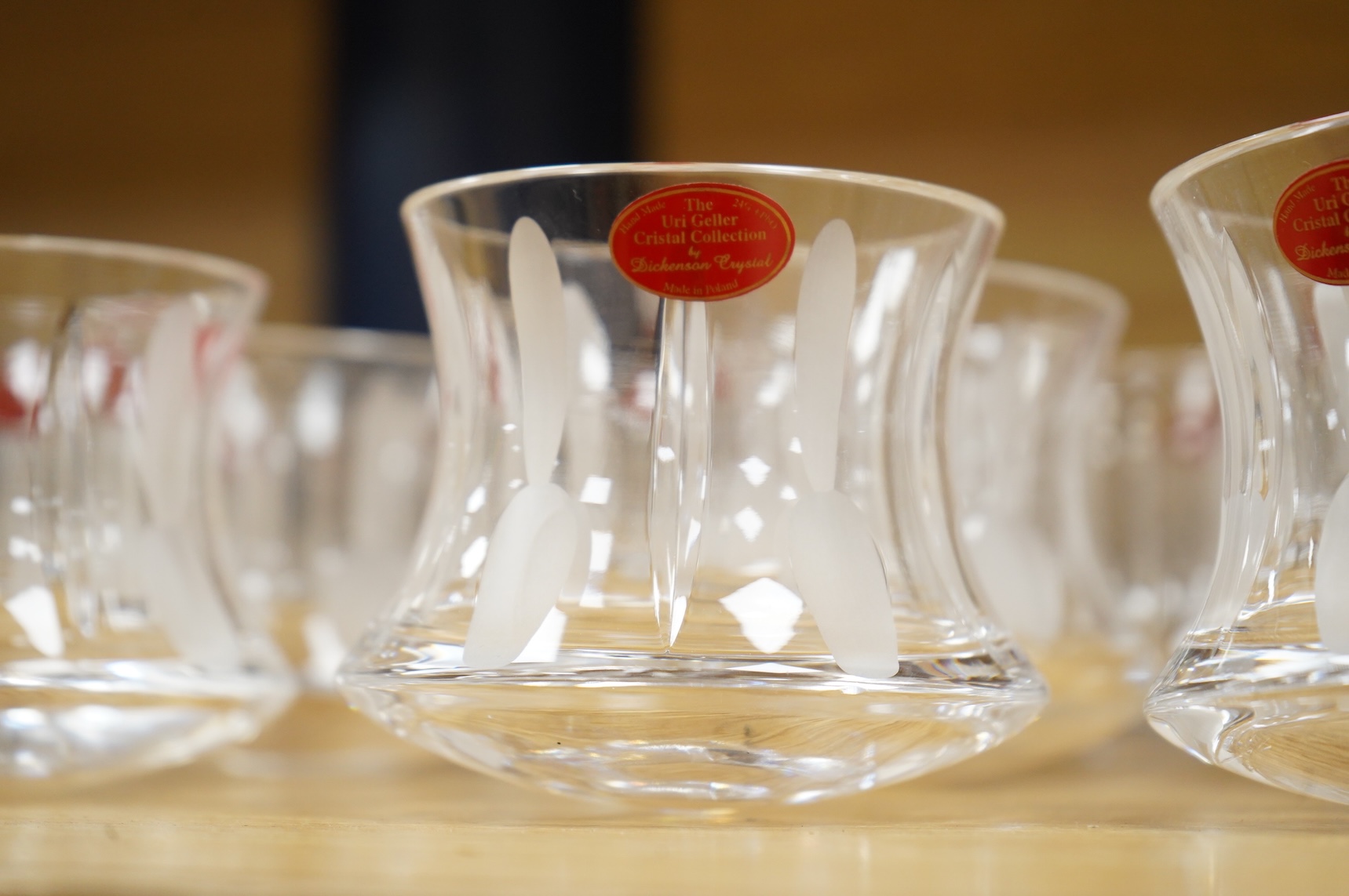 A collection of twenty five Uri Geller Crystal Collection whisky tumblers by Dickenson Crystal, 9cm high
